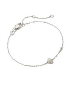 Meet this delicate and dainty layer that’s sure to delight. The Maisie Sterling Silver Delicate Chain Bracelet in Freshwater Cultured Pearl is our most minimal birthstone style, perfect for personalizing your look with elevated materials. Speaking of personalization, this bracelet features an adjustable closure for a custom fit. Freshwater Cultured Pearl represents June birthdays, inspiring intuition, harmony, and confidence. Metal Sterling Silver Why Sterling Silver? Our Sterling Silver collect Sterling Silver Bracelets Women, Delicate Stackable Chain Bracelet, Elegant White Bracelet With Birthstone, Delicate Adjustable Cable Chain Bracelet, Delicate Adjustable Cable Chain Bracelets, Delicate White Chain Bracelet, Everyday White Birthstone Bracelets, Everyday White Birthstone Bracelet, White Minimalist Jewelry With Satellite Chain