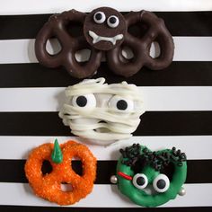 three donuts decorated to look like monsters