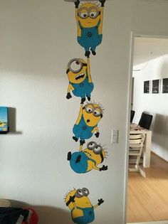 the minionsette wall decals are hanging on the wall in front of an open door