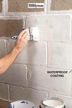 a man is painting a brick wall with paint rollers on it and the words waterproof coating above him