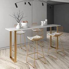 a dining table with four chairs and two vases on the top, in front of a gray wall