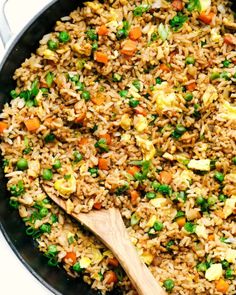 a skillet filled with rice and vegetables