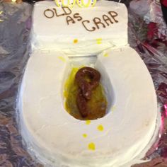 a cake shaped like a toilet with a hot dog in it