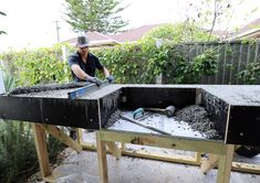 a man is sanding up some concrete