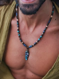 Amazing men necklace with handmade unique polimer clay pendant . The mixed beads of coconut , wood , turquoise , lapis and bronze create an intresting chain of different shapes. The beautiful beaded necklace looks amazing both on men and women. The minimum length is 54 cm and there is a chain with an exstantion of 4 cm. Feel free to contact me if you want to modify the length. The pendant is handmade with polymer clay, has a  nice rustic view, and is very light. Includes a cool bio gift wrapping Male Necklace Diy, Men’s Crystal Necklace, Handmade Necklaces For Men, Beaded Necklace Men’s, Diy Men Necklace, Man Beaded Necklace, Men Beads Necklace, Diy Necklace For Men, Men's Beaded Necklace