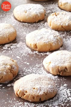 freshly baked cookies on a baking sheet with powdered sugar