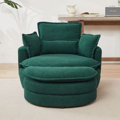 a green chair sitting on top of a white floor