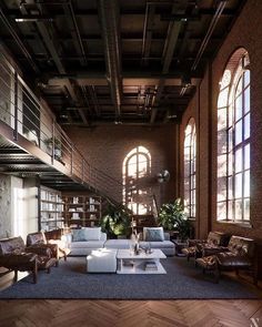 a large living room with lots of windows and couches on the floor in front of bookshelves