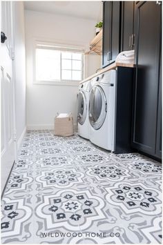 a washer and dryer sitting in a laundry room next to eachother