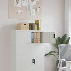 a white cabinet sitting next to a computer desk