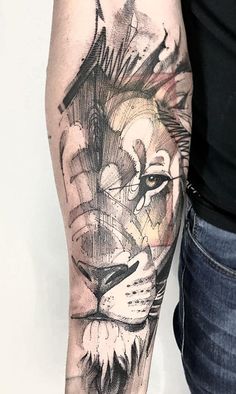 a man with a lion tattoo on his arm