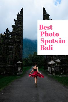 a woman in a red dress is walking down the road with a sign that says best photo spots in bali