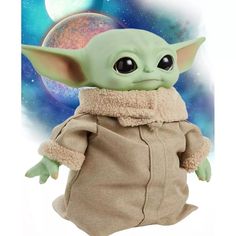 the child yoda doll is shown in front of an image of planets and stars