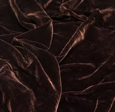 a close up view of a dark brown blanket