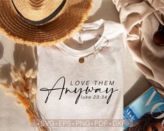 a white shirt with the words so loved on it next to a hat and sunglasses