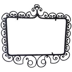 a black metal frame with swirly designs on the edges and an empty white background