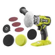 a cordless drill with various tools and sanding discs around it on a white background