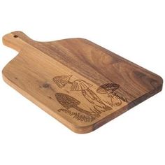 a wooden cutting board with an image of mushrooms on it