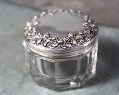 a small silver box sitting on top of a table