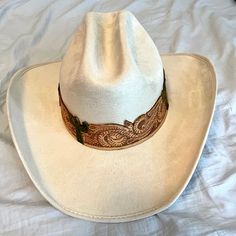 Light Tan/Cream Cowboy Hat New Never Worn With Cactus Details Comes With Dust Bag And Cleaning Brush Cream Cowboy Hat, Cream Western Straw Hat With Short Brim, Western Cream Straw Hat With Short Brim, Western Style Cream Straw Hat With Short Brim, Cream Western Straw Hat For Rodeo, Western Cream Straw Hat For Rodeo, Western Cream Straw Hat For Country Events, Fitted Western Cream Hat, Fitted Cream Western Hat