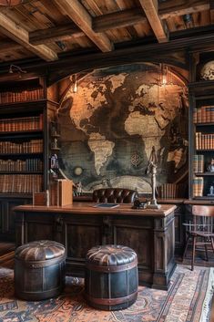 an old world map is on the wall behind a desk with two stools in front of it