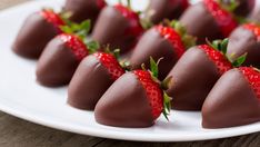 chocolate covered strawberries arranged on a white plate