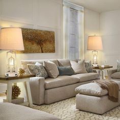 a living room filled with furniture and lamps