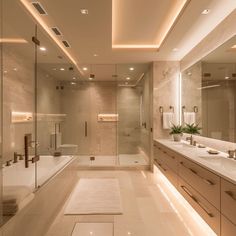 a large bathroom with two sinks and a bathtub in the middle, along with a walk - in shower