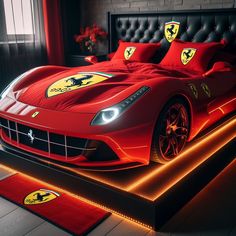 a red ferrari car bed in a bedroom with lights on the headboard and foot board