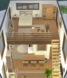 an aerial view of a bedroom and living room in a house with stairs leading up to the second floor