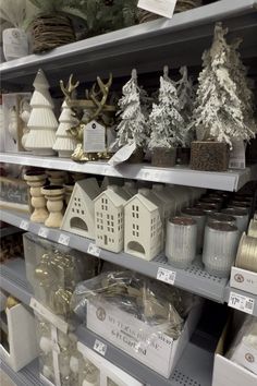 the shelves are filled with many different types of christmas trees and other holiday decor items