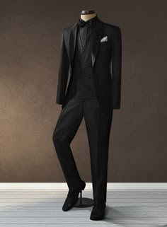 For your first good suit, the universally accepted rule among the fashionable crowd is to keep it black and our Black Merino Wool Tuxedo suit would be a great addition to your wardrobe. Crafted from wool and polyester, you can't go wrong with our Black Tuxedo if you have to attend any formal events. A fail-safe option to give you that bold sophisticated look. 
 
 Featuring satin lapel, matching satin covered buttons, pants with satin stripes and gentle texture at its surface, our tuxedo is a subtle fashion-forward take on a traditional tailoring. 
 
 Look Includes  Black Merino Wool Fabric  One Button Tuxedo Jacket Style  Shawl Lapel  Black Tuxedo Buttons  Three Cuff Buttons  Two Welted Back Pockets on Trousers   
 Double Breasted Vest can be selected during customization if required. Black Tuxedo With Tie, Tuxedo For Men Black, Classic Black Suit For Black Tie Event, Luxury Tailored Three-piece Suit For Black Tie Events, Suits Black, Elegant Black Suit Men, Tux Wedding Groom, Black Suit For Men Formal, Classic Black Slim Fit Suit