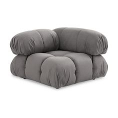 a grey chair with two pillows on it's back and one arm in the shape of a recliner