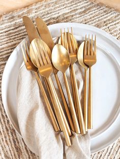 Hand forged in Moradabad, a city in India known for metal craftsmanship, our Tides Flatware is a testament to timeless quality. Hand-forged from stainless steel, it boasts a distinctive distressed matte gold finish that proudly bears the authentic marks of their skilled makers. With an effortless look for everyday tablescapes, it also adds timeless luxe when dressed up for special occasions. Each piece is sold individually to give you the flexibility to buy the exact number to suit your entertai Gold Cutlery Wedding, Everyday Tablescapes, Brass Silverware, Brass Cutlery, Gold Utensils, Matte Gold Cutlery, Gold Cutlery Set, Gold Cutlery, Creative Candles