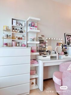 a white desk topped with lots of drawers next to a pink chair and shelf filled with cosmetics