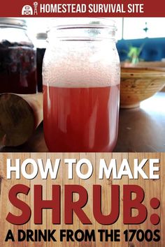 a jar filled with liquid sitting on top of a table next to a wooden board