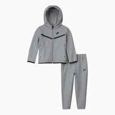 The Nike Sportswear Tech Fleece Set is made with soft, lightweight fleece fabric to help keep little ones warm when temperatures drop. Benefits Nike Tech Fleece fabric offers the ultimate in lightweight warmth. Binding along the cuffs and hem creates a clean, stay-put look. Product Details Full-length zipper Front pockets on hoodie and pants 67% cotton/33% polyester Machine Wash Color: Dark Grey Heather Style: 86H052-042 Tech Fleece Outfit, Nike Tech Jacket, Jogging Nike, Baby Boy Nike, Mommy Daughter Outfits, Fleece Outfit, Tech Fleece Hoodie, Nike Sportswear Tech Fleece, Kids Sportswear