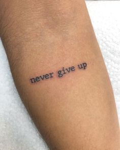 a tattoo saying never give up on someone's arm