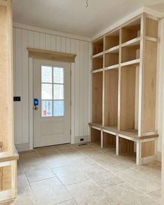 the empty room is clean and ready to be used as a storage area for books