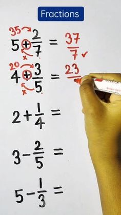 a person writing on a white board with numbers and fractions written in red ink