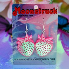 USA-made strawberry earrings! Made of lightweight durable acrylic plastic and hypoallergenic sterling silver ear hooks. Choose from hot pink iridescent or classic iridescent. Condition: New. Personally designed, laser-cut, hand-assembled. Earring Care: Acrylic is extremely lightweight and durable, but can get scratched. To avoid this, please handle your earrings with care! Avoid contact with hairspray, perfume, sweat, and water, wipe clean and store away from direct sunlight. To clean the earrin Masc Cottagecore, Fav Products, Strawberry Earrings, Fruit Summer, Uncommon Words, Kawaii Earrings, Pink Iridescent, Modern Tattoos, Strawberry Fruit