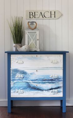 a blue painted dresser with the words coastal makeover on it's sideboard