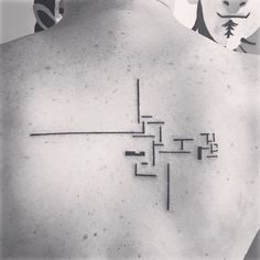 a man with a cross tattoo on his back