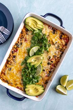 an enchilada casserole with avocado and cilantro