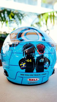 a blue helmet sitting on top of a table