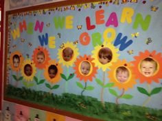 a colorful bulletin board with children's faces on it