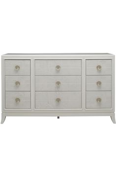 a white dresser with four drawers and two doors