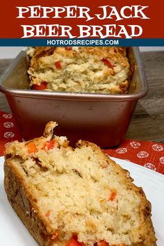 a loaf of pepper jack beer bread on a white plate with a red and blue napkin