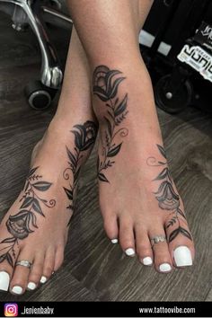 a woman's feet with tattoos on them