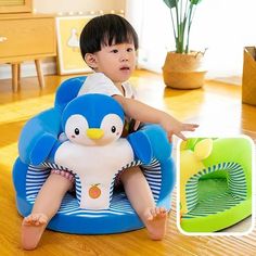 a little boy sitting on top of a blue chair